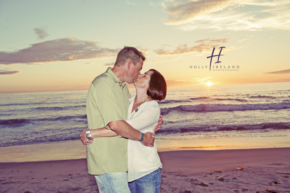 Romantic couple photographed at the beach in Carlsbad at sunset