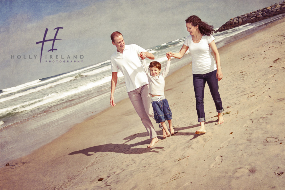 fun and creative family photography done at the beach in Carlsbad