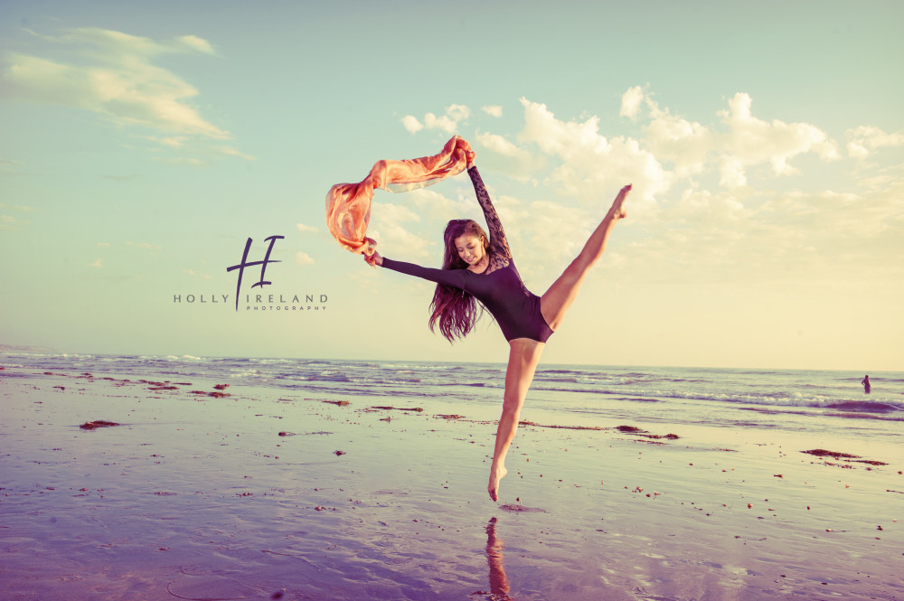 jumping dancer at the beach during a sunset photo shoot in San Diego Ca