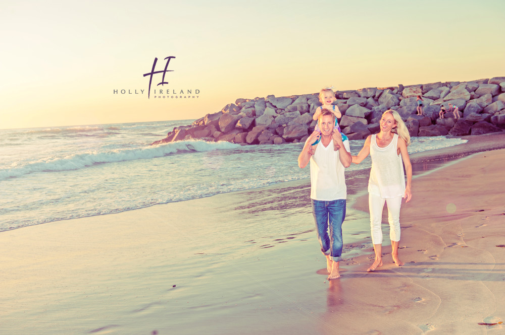 Cute family walking at the beach at sunset photos www.hollyireland.com