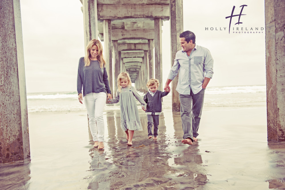 cute family under a pier in san diego ca