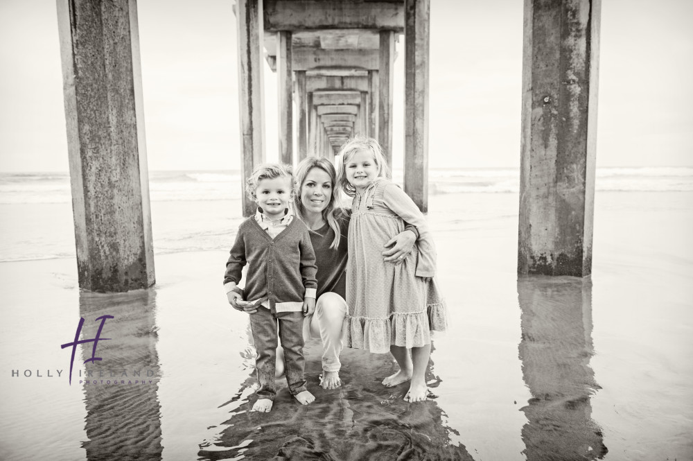 black and white beach pier family photos