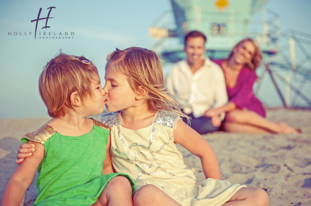 adorable sisters photographed at the beach