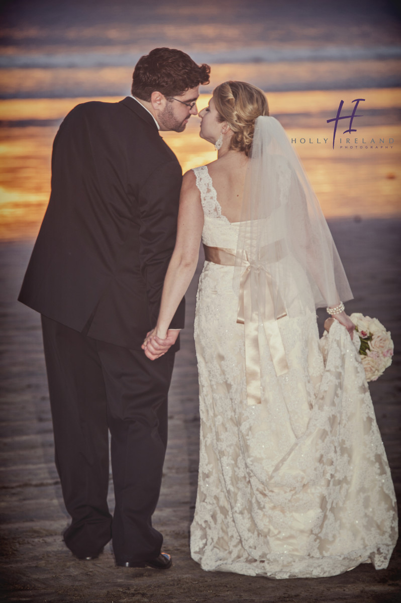 beach sunset wedding kiss