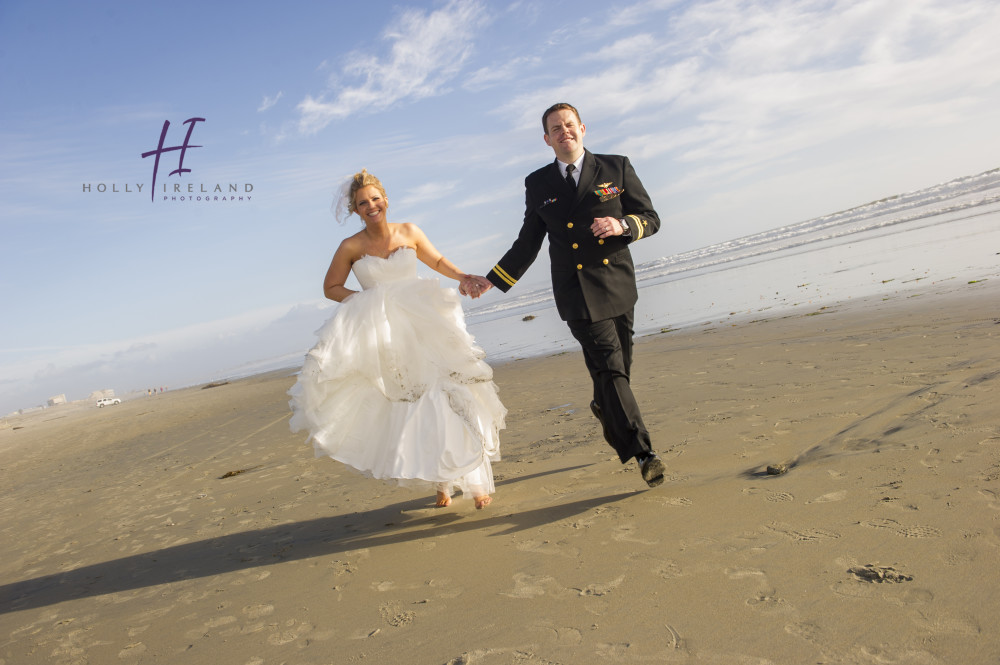 Candid beach bride and groom wedding photography