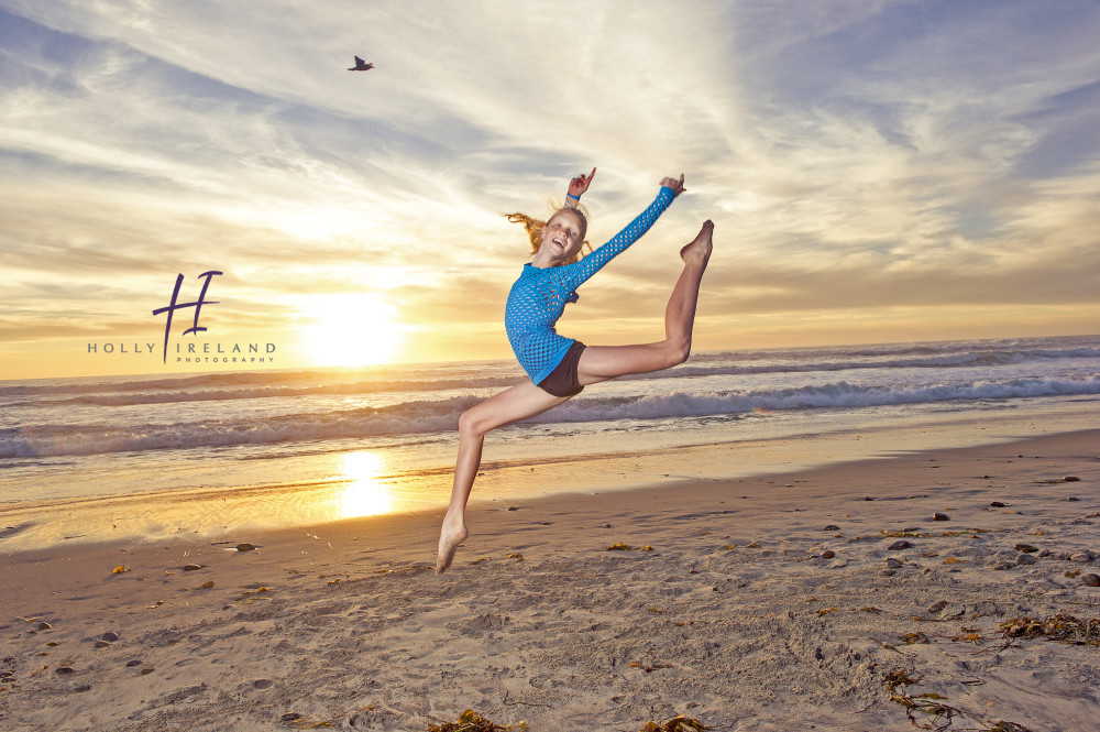 dancer jumping at the beach at sunset