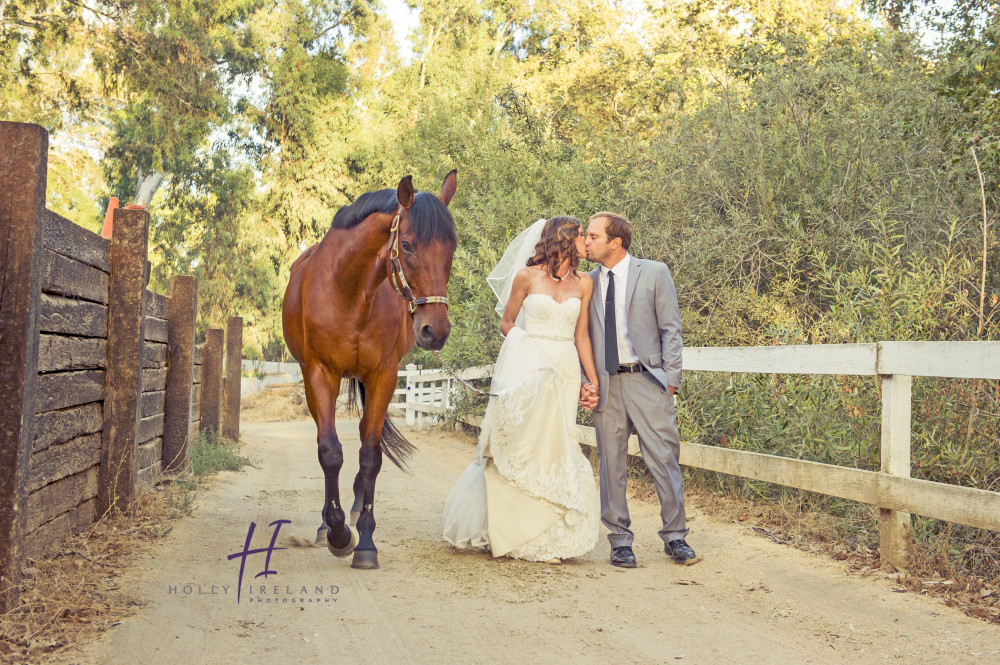 ranch style bride and groom photos with a horse in san diego