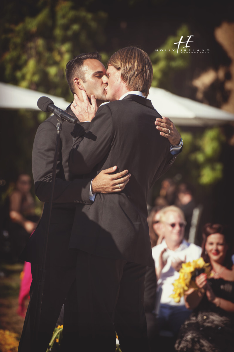 first kiss at the same sex wedding photos in San Diego