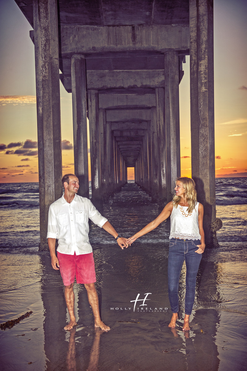 Susnet beach engagment photos under a pier