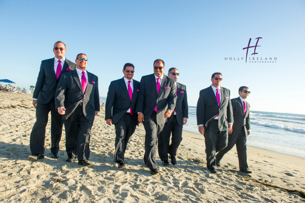 Fun grooms photo on the beach 