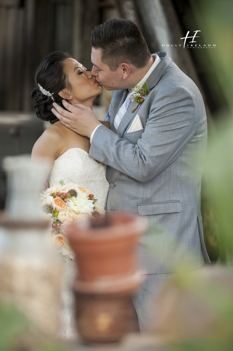 kissing rustic wedding 