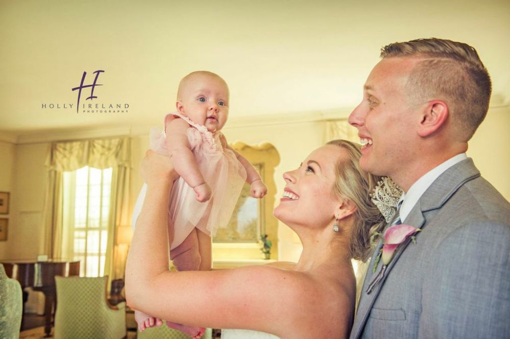 family, bride and groom with baby 