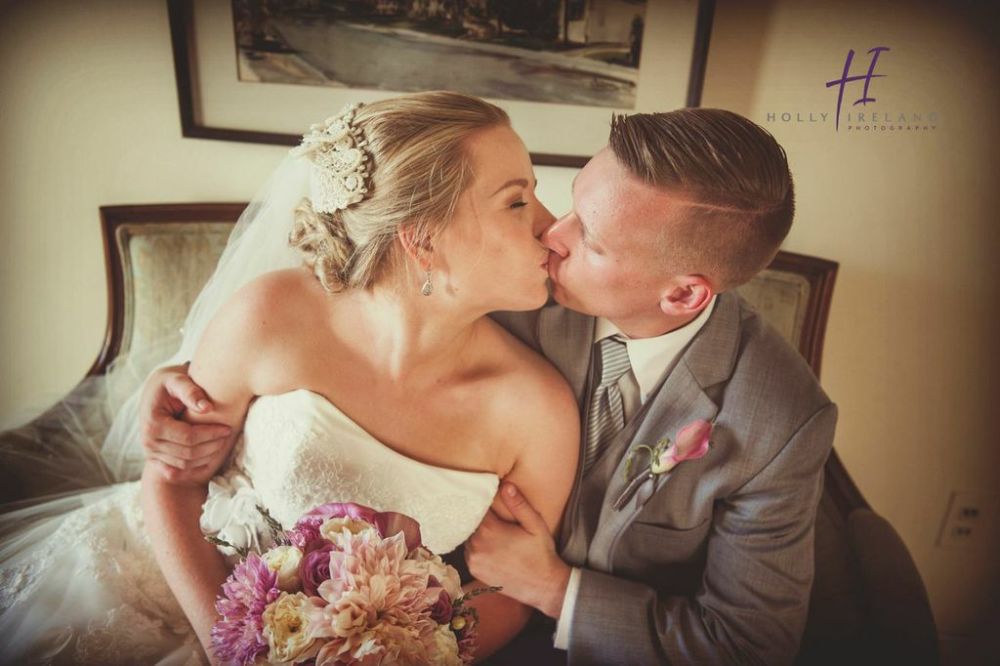 bride and groom kissing rustic san diego 