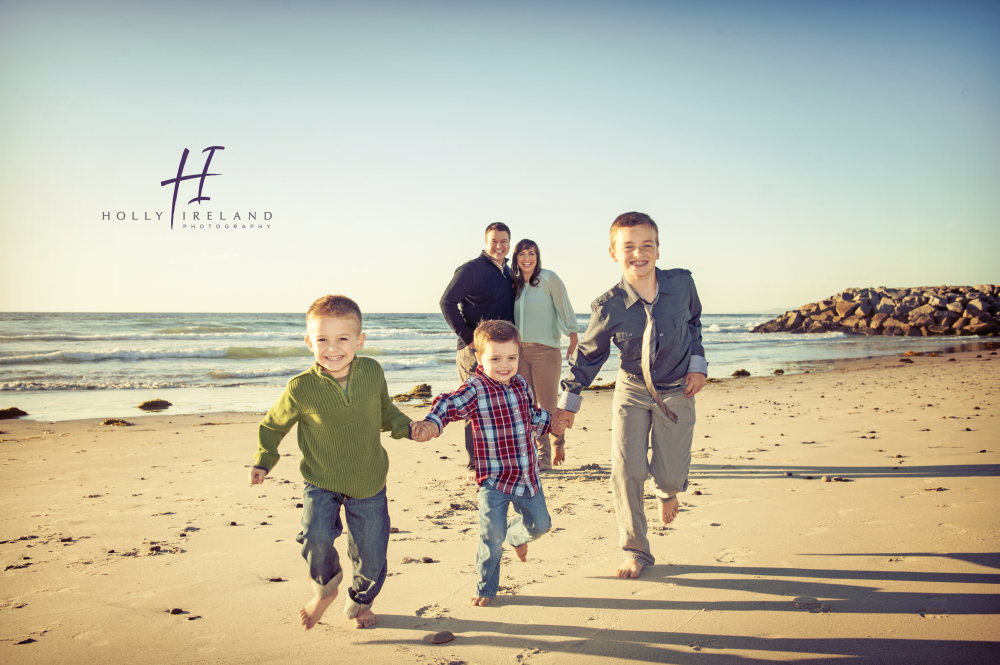 fun creative family beach photos in San Diego California