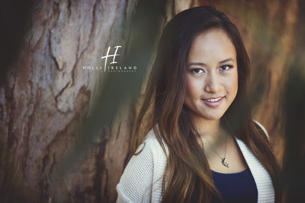 Beautiful california high school senior photos of a girl on a trial and at the beach