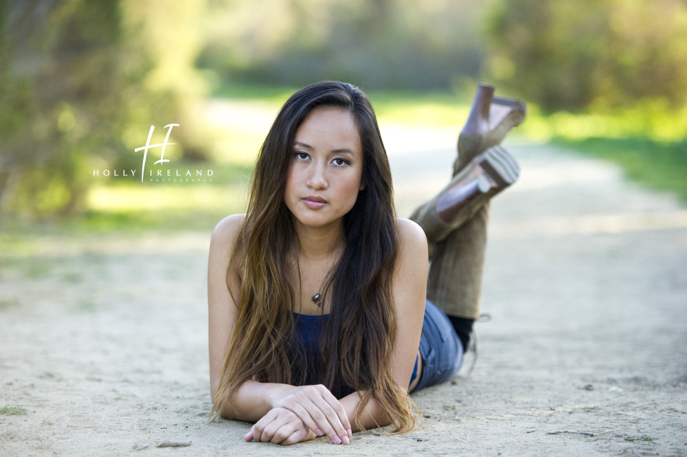 Beautiful california high school senior photos of a girl on a trial and at the beac