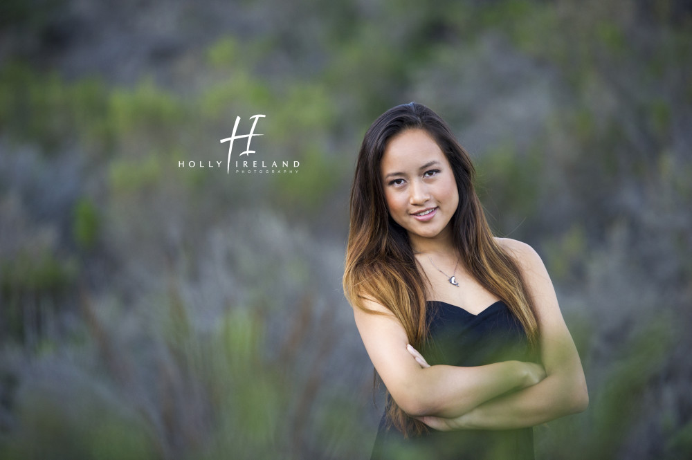 Beautiful california high school senior photos of a girl on a trial and at the beac